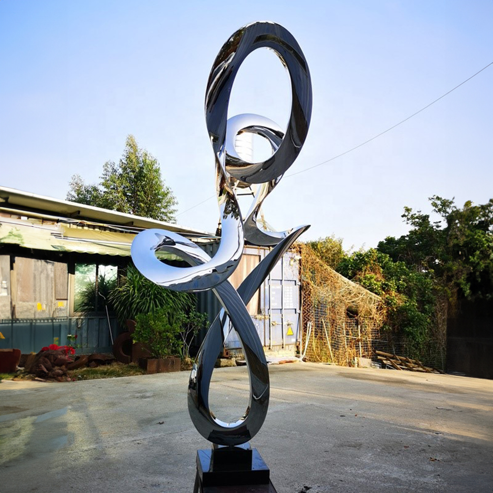 Tall abstract Stainless Steel Modern Landscape Sculpture with twisted hollow rings