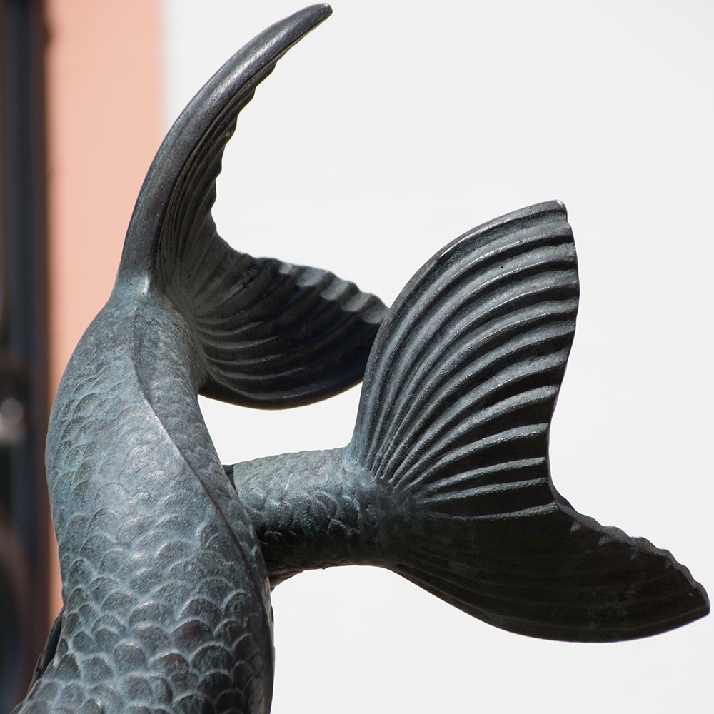 close-up view of the tails of mermaid fountain