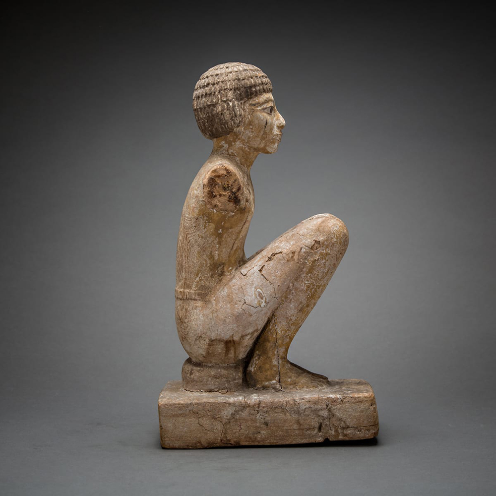 side view of an Egyptian figure sculpture