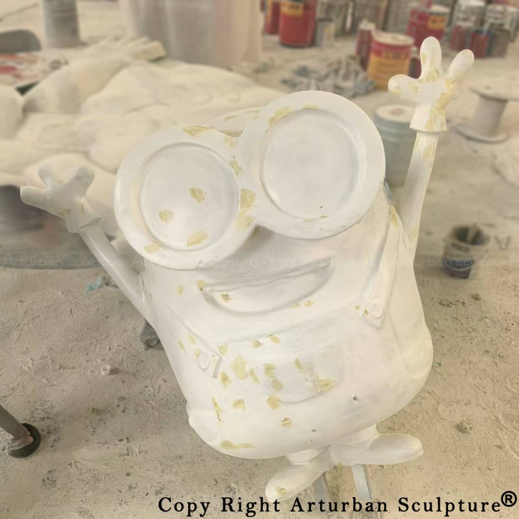 6-Sanding the fiberglass Minion Bob Sculpture surface