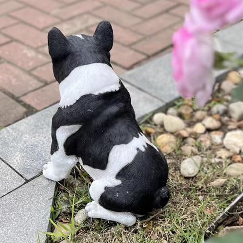 Realistic French Bulldog garden decor sitting near