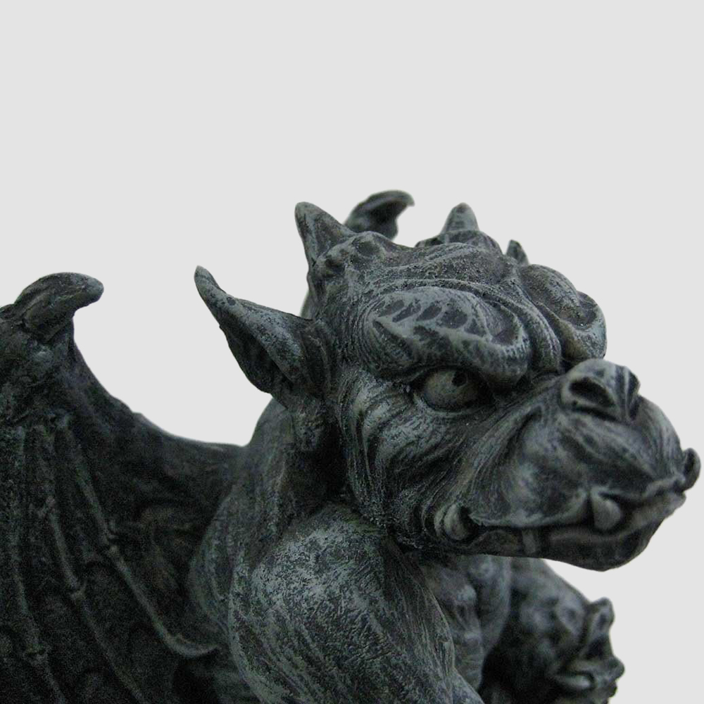 bronze gargoyle statues face close-up