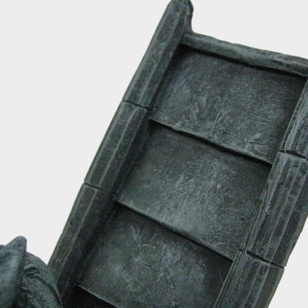 roof section with bronze gargoyle detail