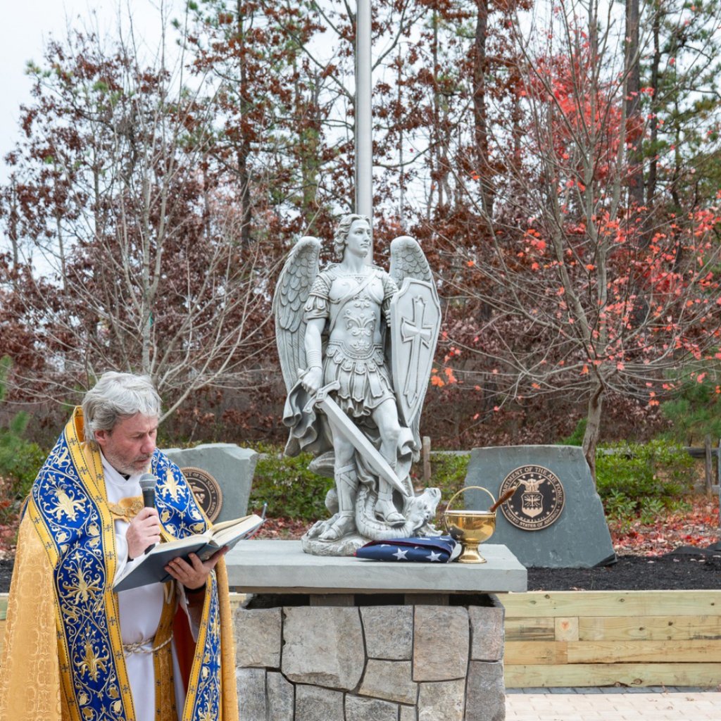 14-2 Priest blessing St Michael statue
