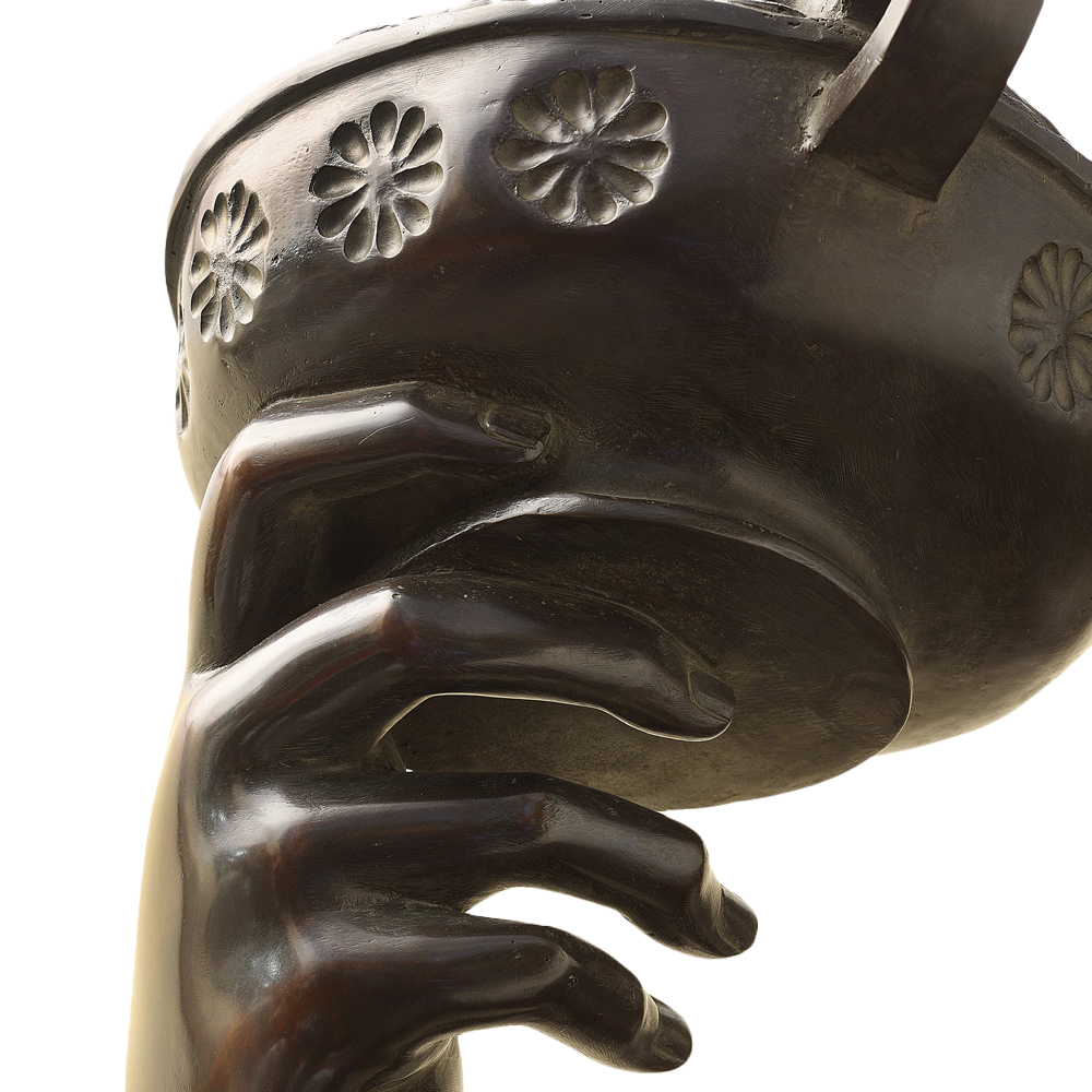 Hand holding cup details of baccus statue