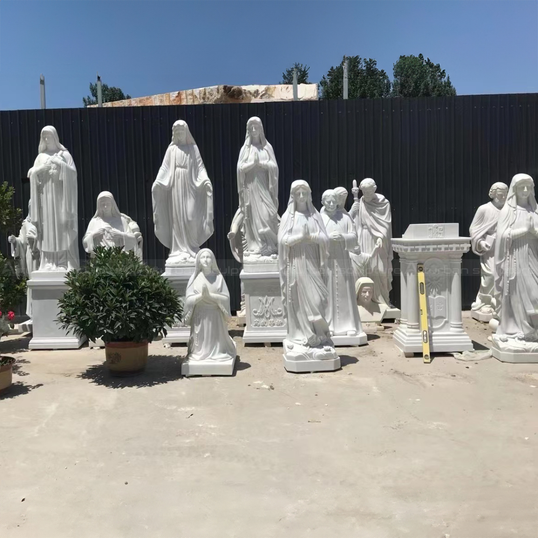 Multiple Mother Mary Marble Statues Display