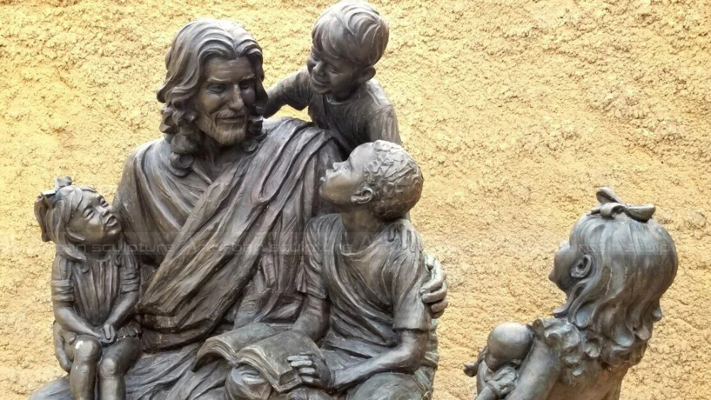 Bronze seated Jesus with children outdoor