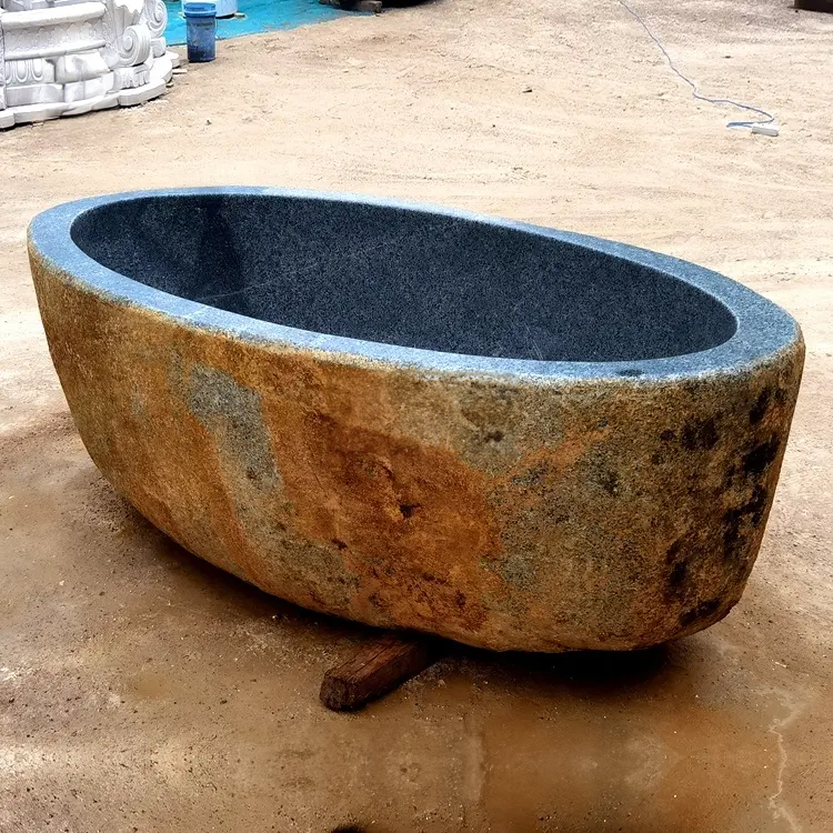 Hand carved Natural Stone Freestanding Bath organic form