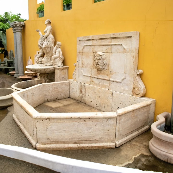 Mediterranean wall fountain garden with classic male face relief
