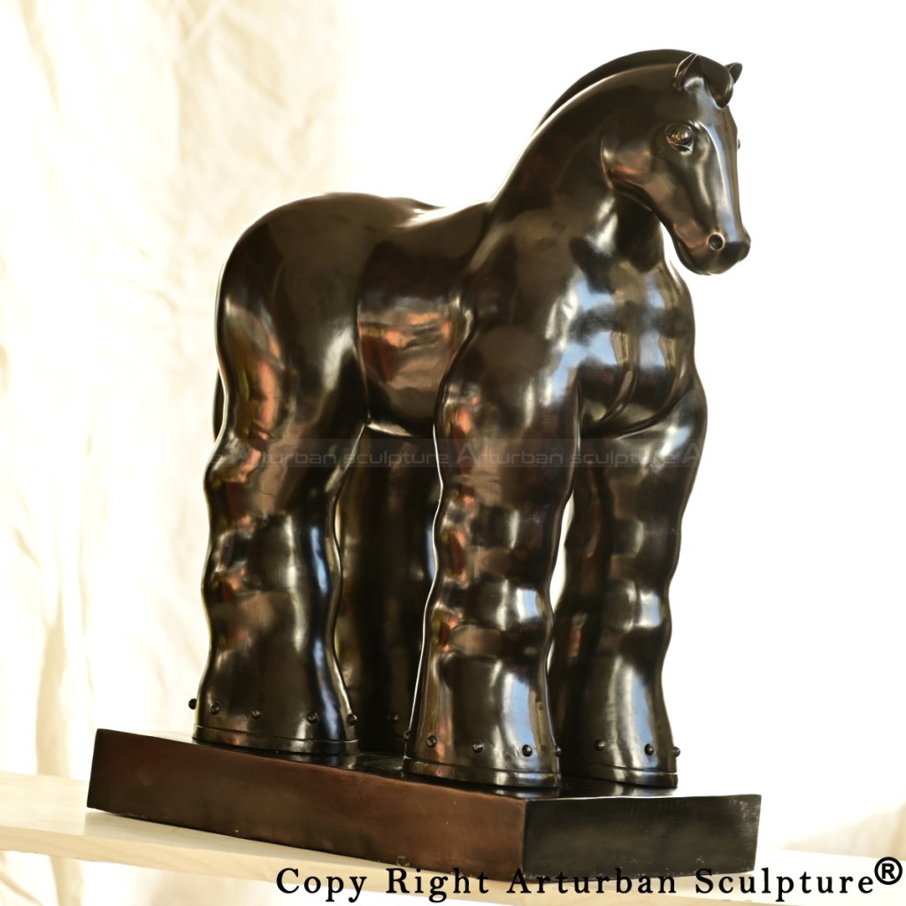 Frontal view of a stylized Fat Horse Statue made of copper