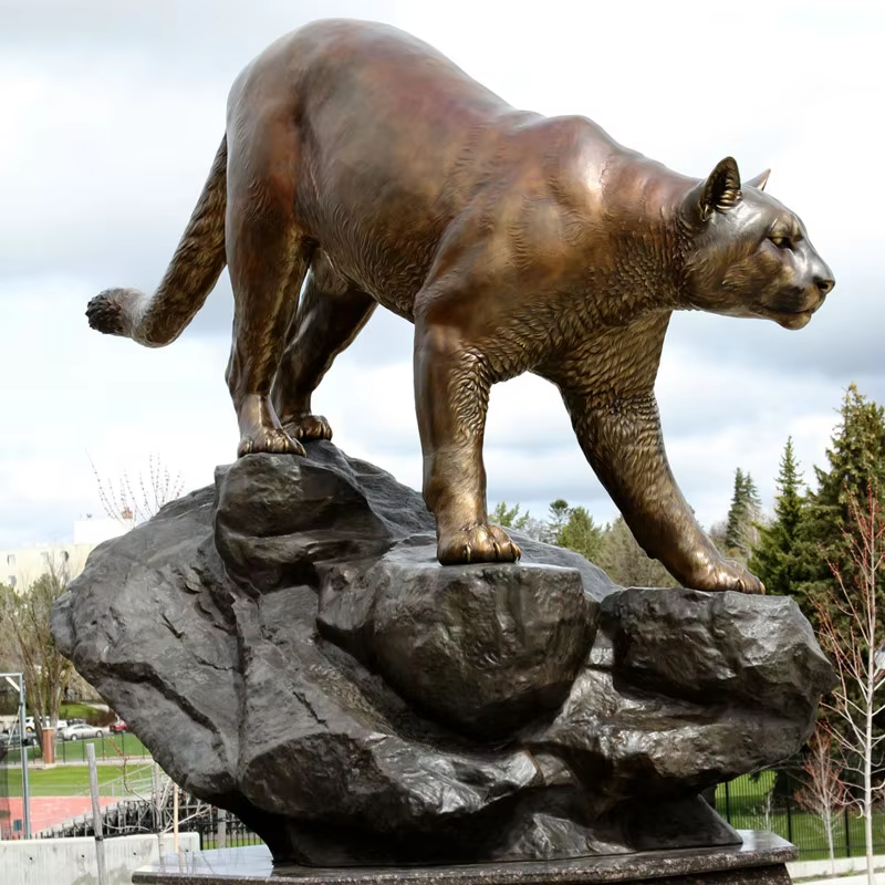 Bronze Puma Sculpture walking forward on rock base