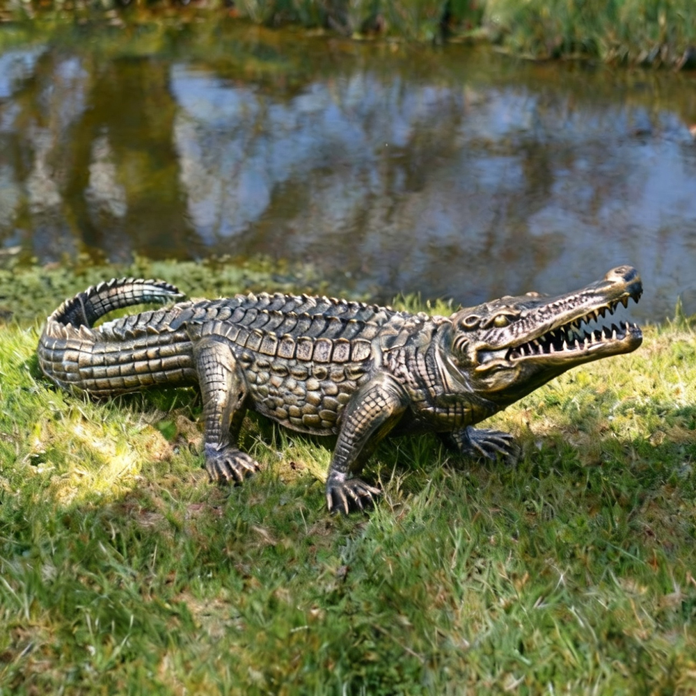 Crocodile Metal Sculpture bronze by pond grass