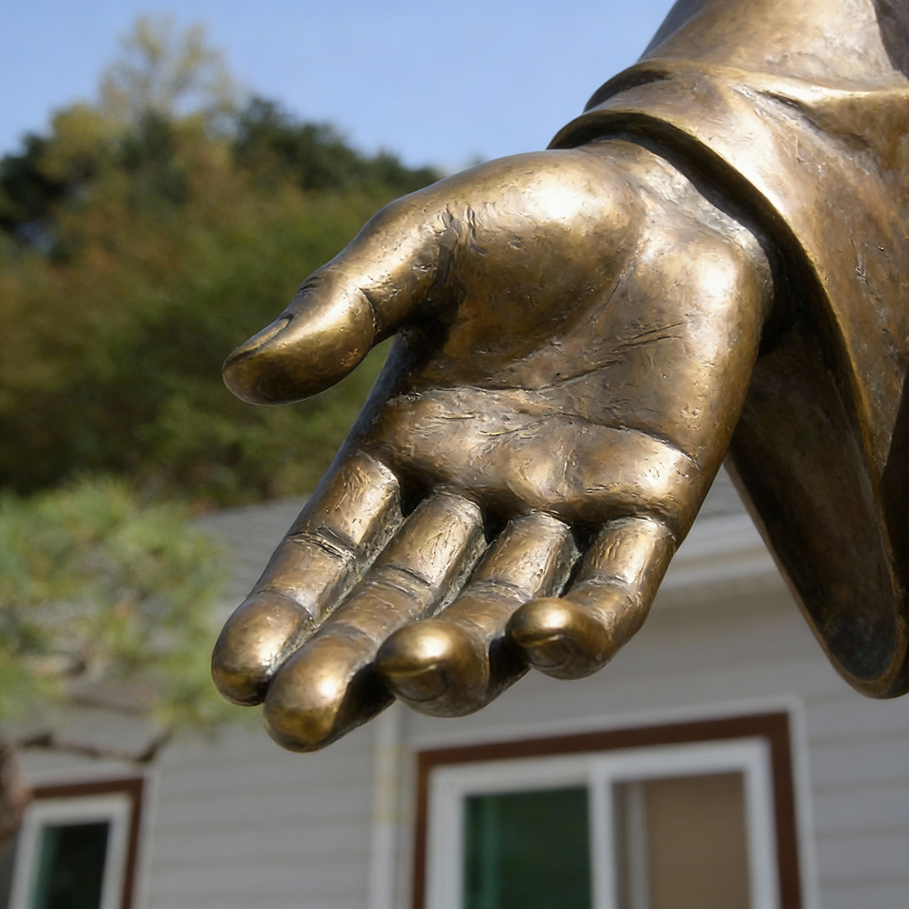 Jesus Statue Bronze hand gesture close-up