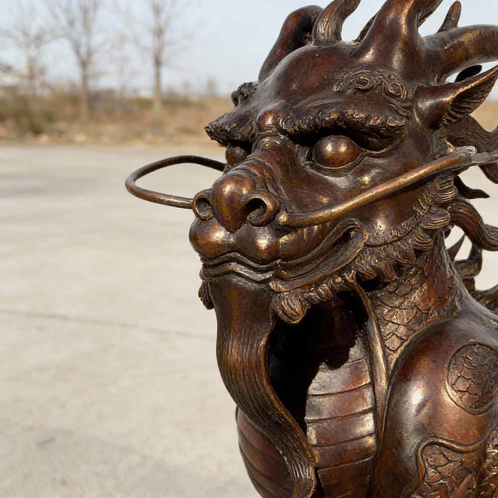 bronze Chinese Qilin Statue head close-up with horns and whiskers