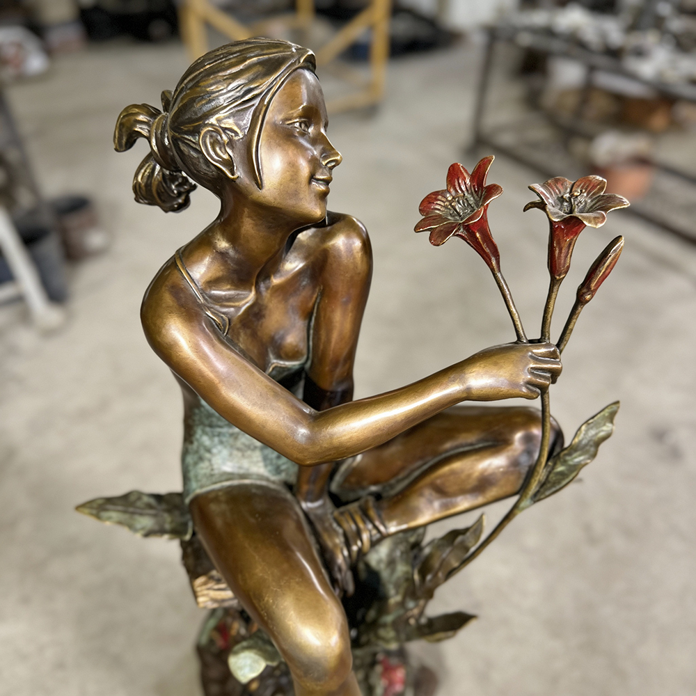 bronze Flower Girl Statue Outdoor close face flowers