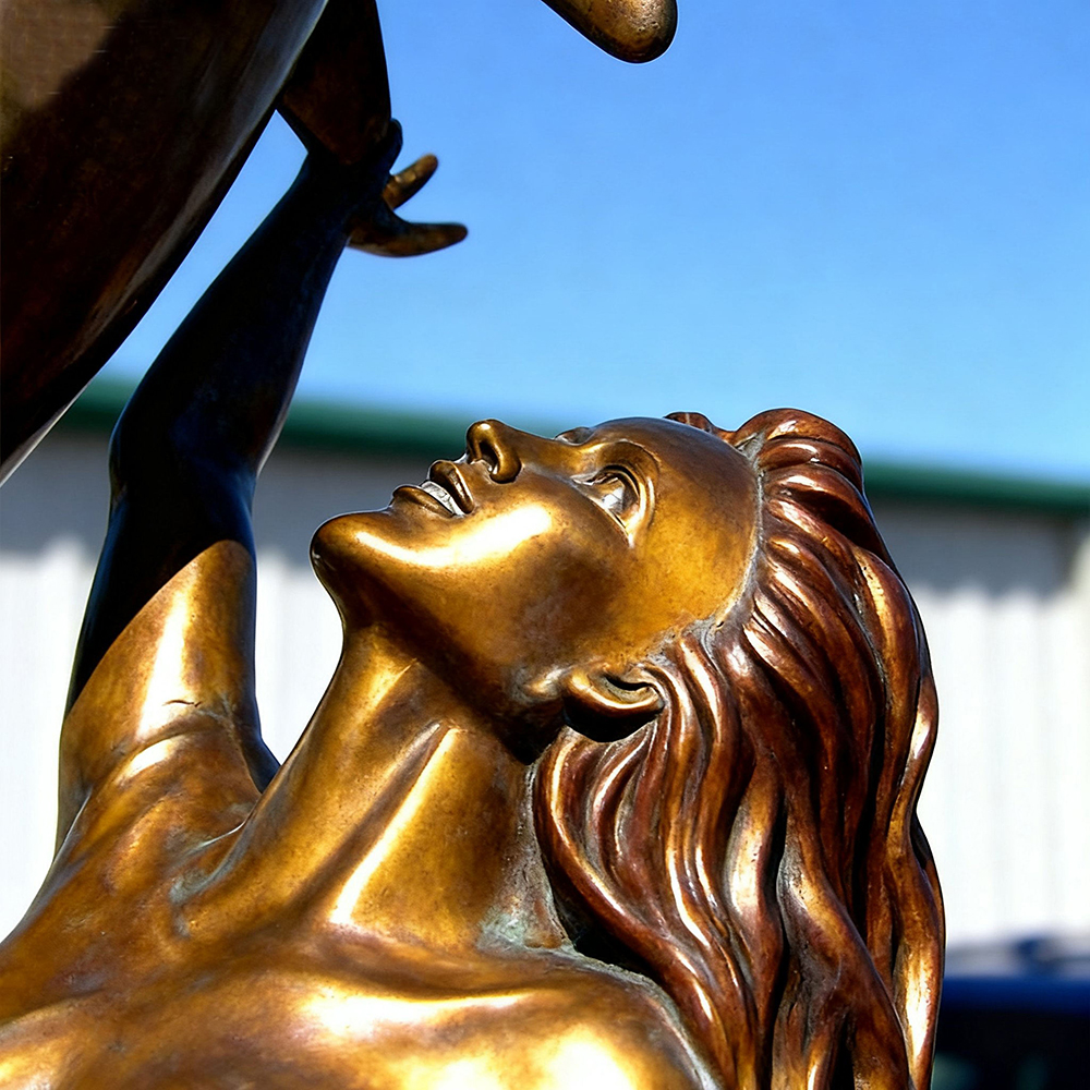 bronze Mermaid and Dolphin Sculpture face looking upward