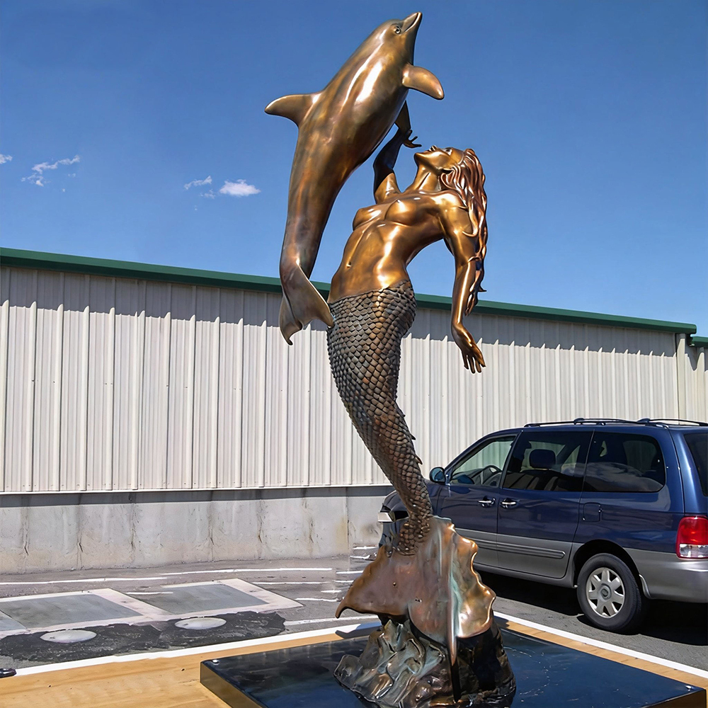 bronze Mermaid and Dolphin Sculpture interaction
