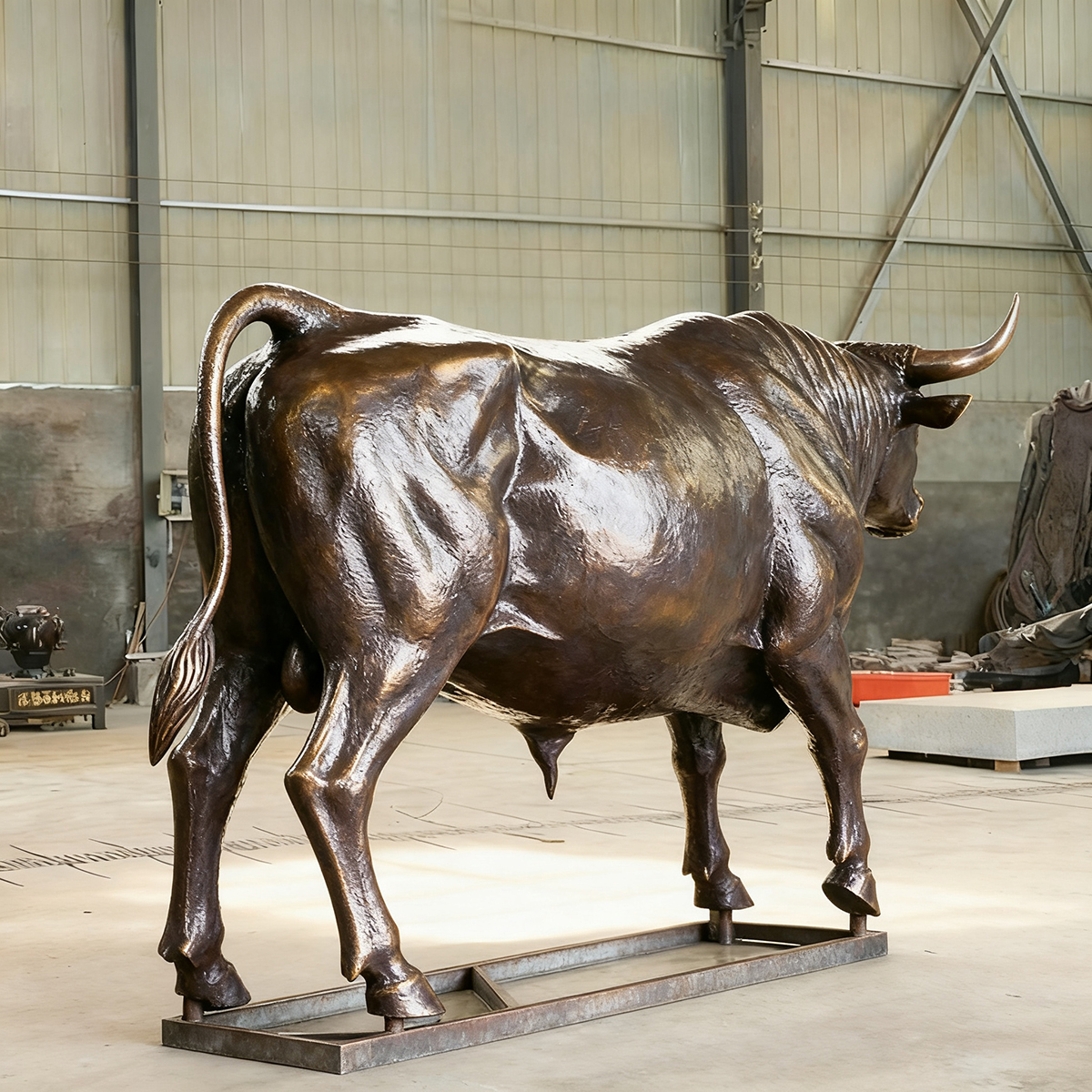 bronze Ox Sculpture rear view raised tail and strong hind legs