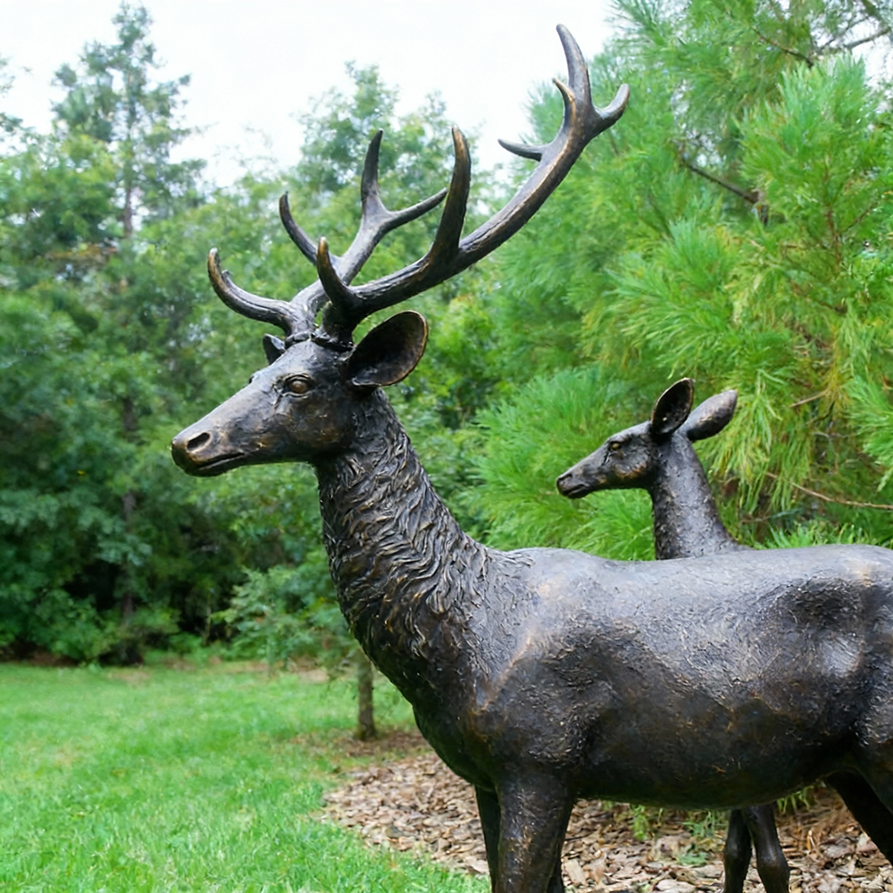 bronze Stag and Doe Sculpture in garden