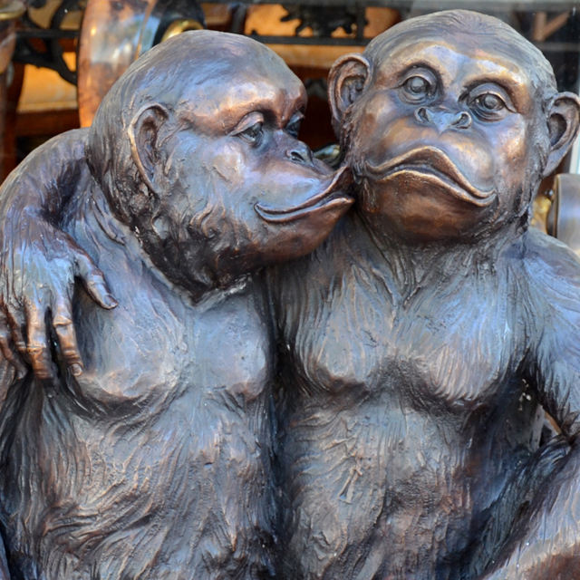 bronze Three Wise Monkeys statue whispering detail