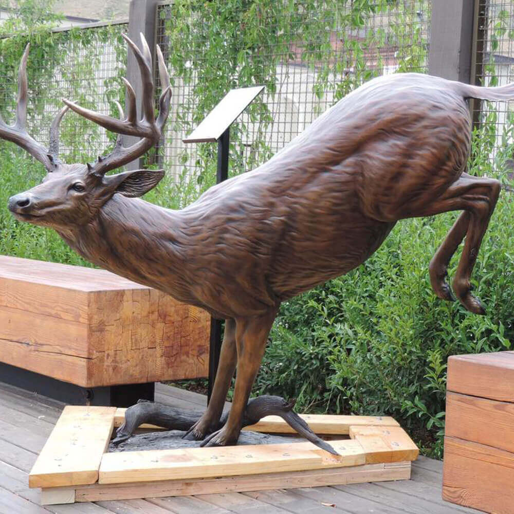 bronze Vintage Deer Statue leaping over branch