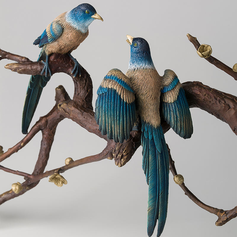 bronze magpie sculpture pair perched on branch
