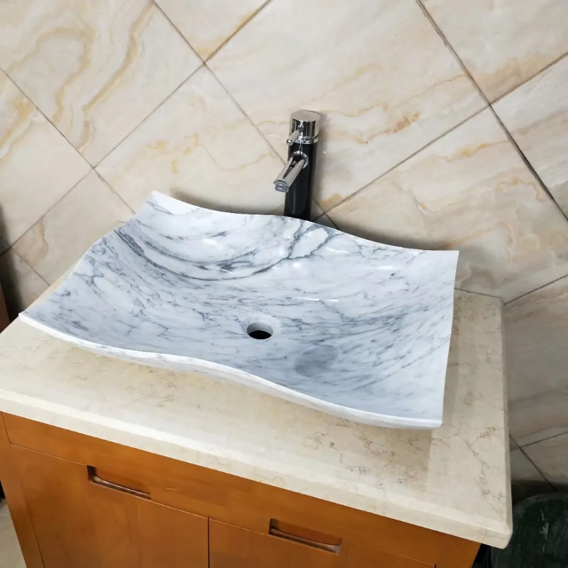white marble irregular vessel sink