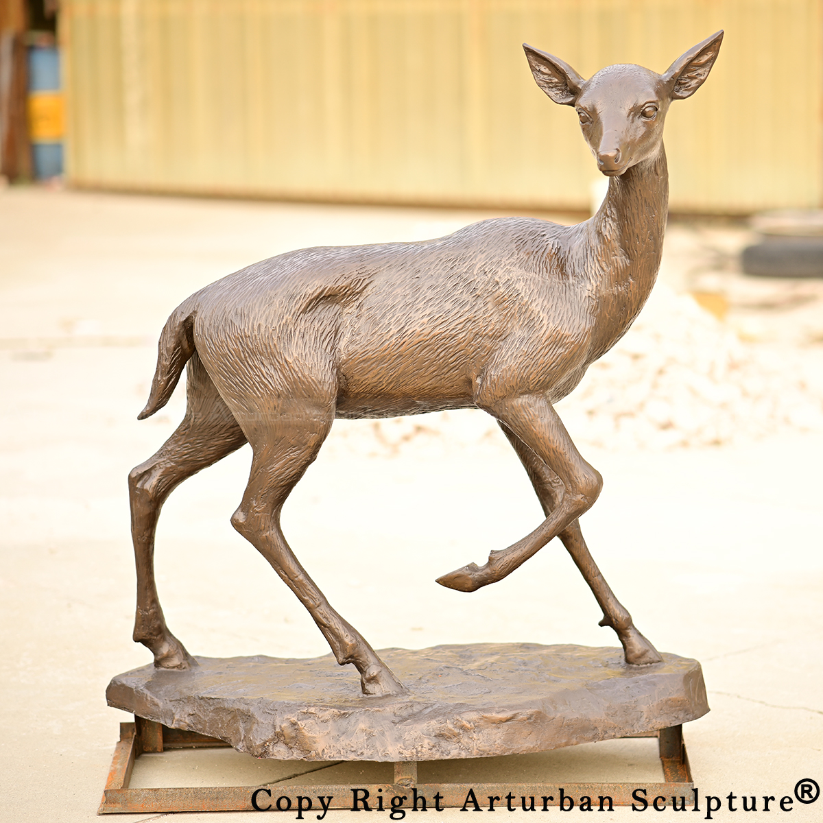 0 Walking bronze fawn sculpture side view