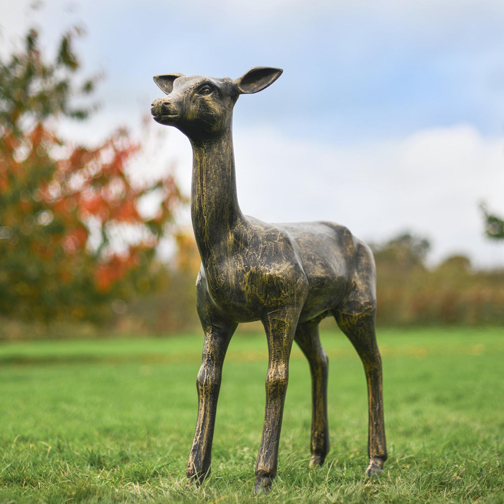 1-(10) Tall bronze young deer standing on lawn
