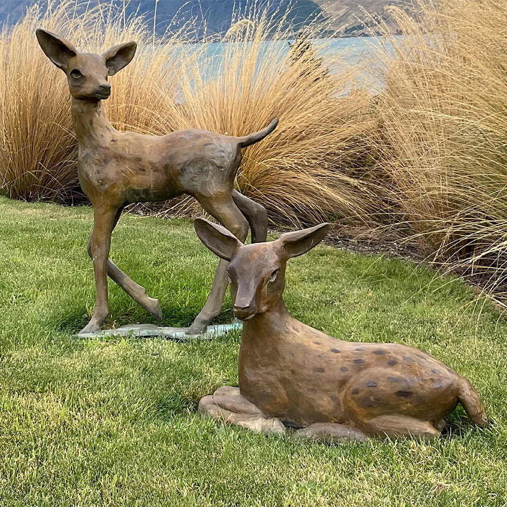 1-(13) Spotted fawn sculpture on garden lawn