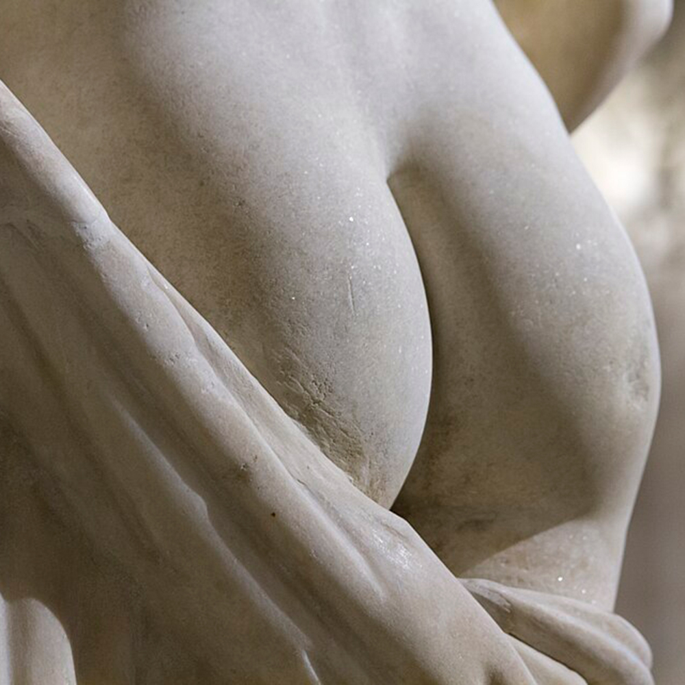 Venus with Cupid sculpture butt detail