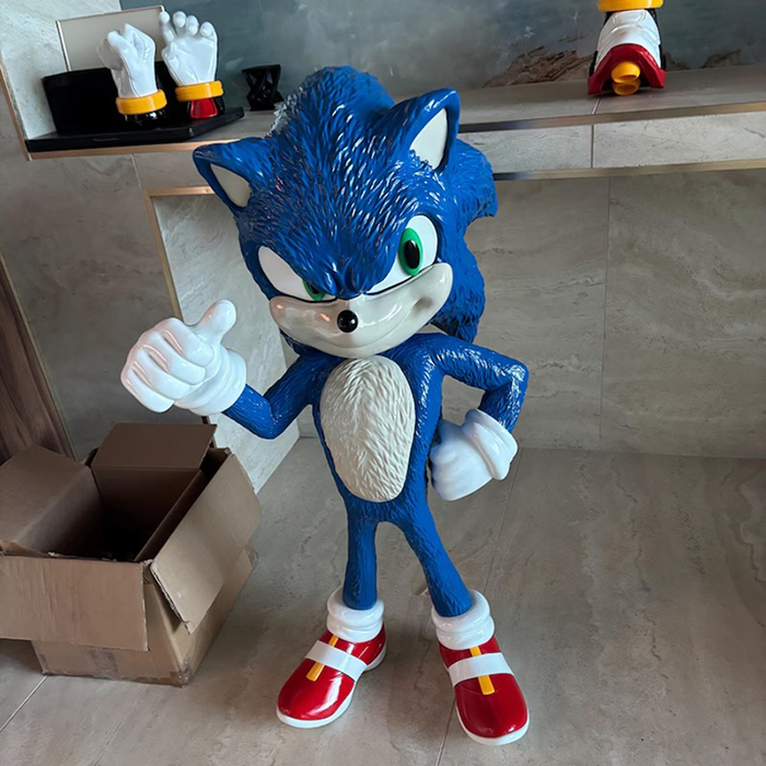 fiberglass sonic sculpture with one thumb up
