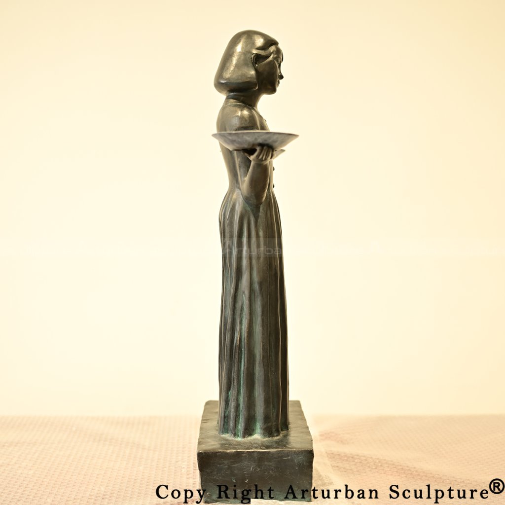 4 Side view of the bronze Bird Girl sculpture