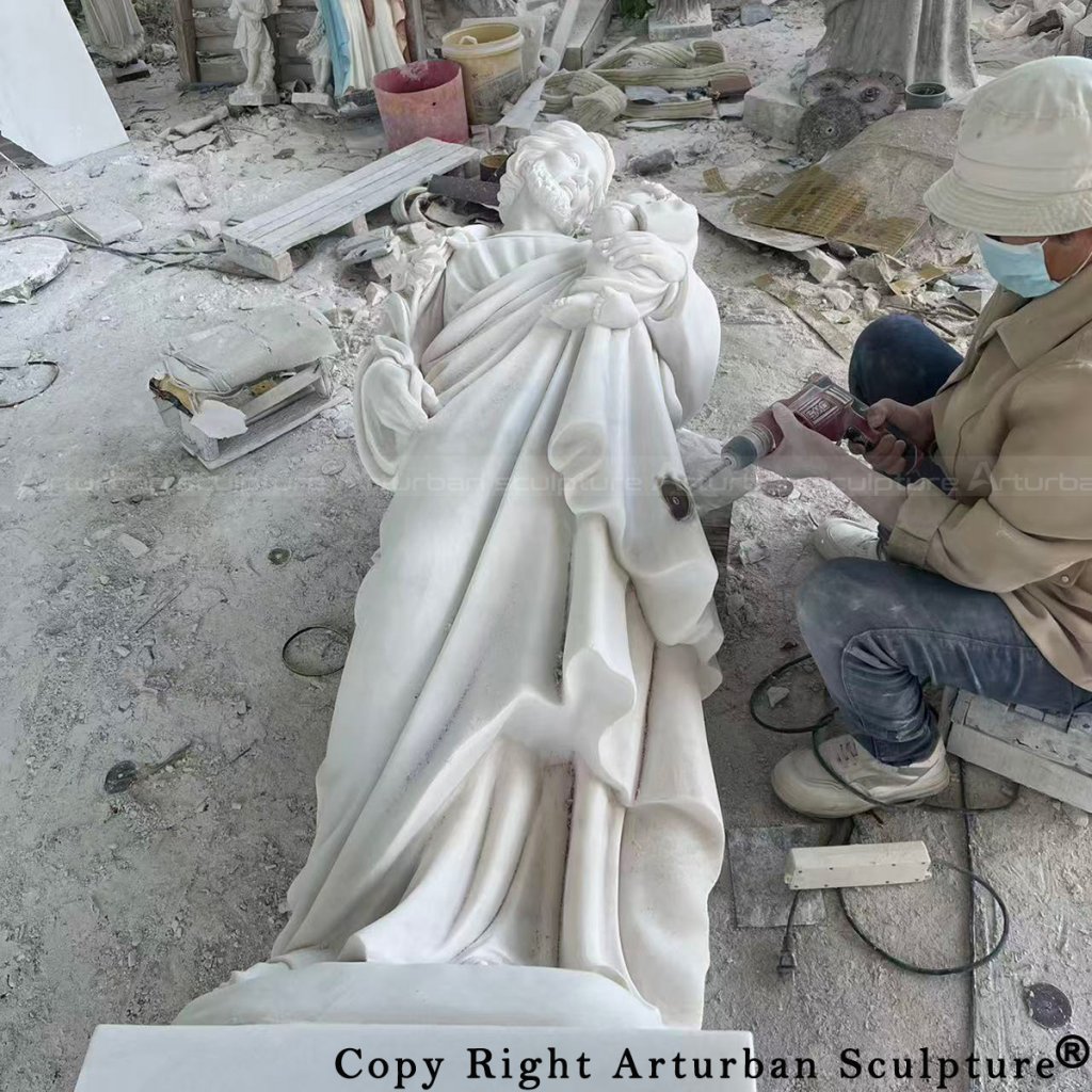 5 Hand Carving the Details of Saint Joseph and Child Jesus