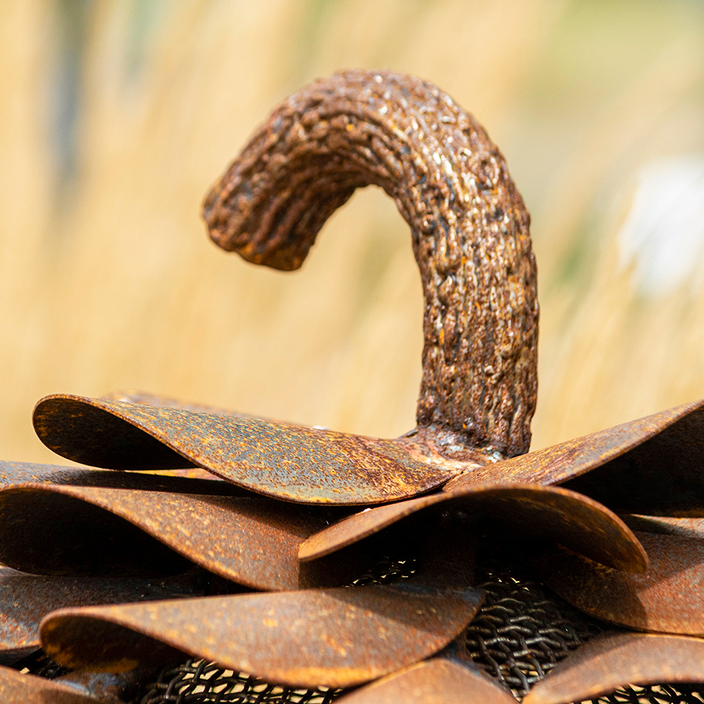 Close view of large metal pine cone