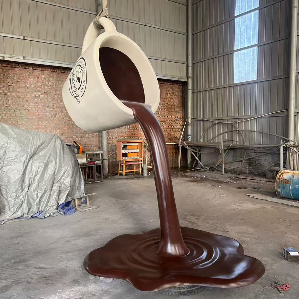 Fiberglass Pouring Coffee Cup Sculpture angled view