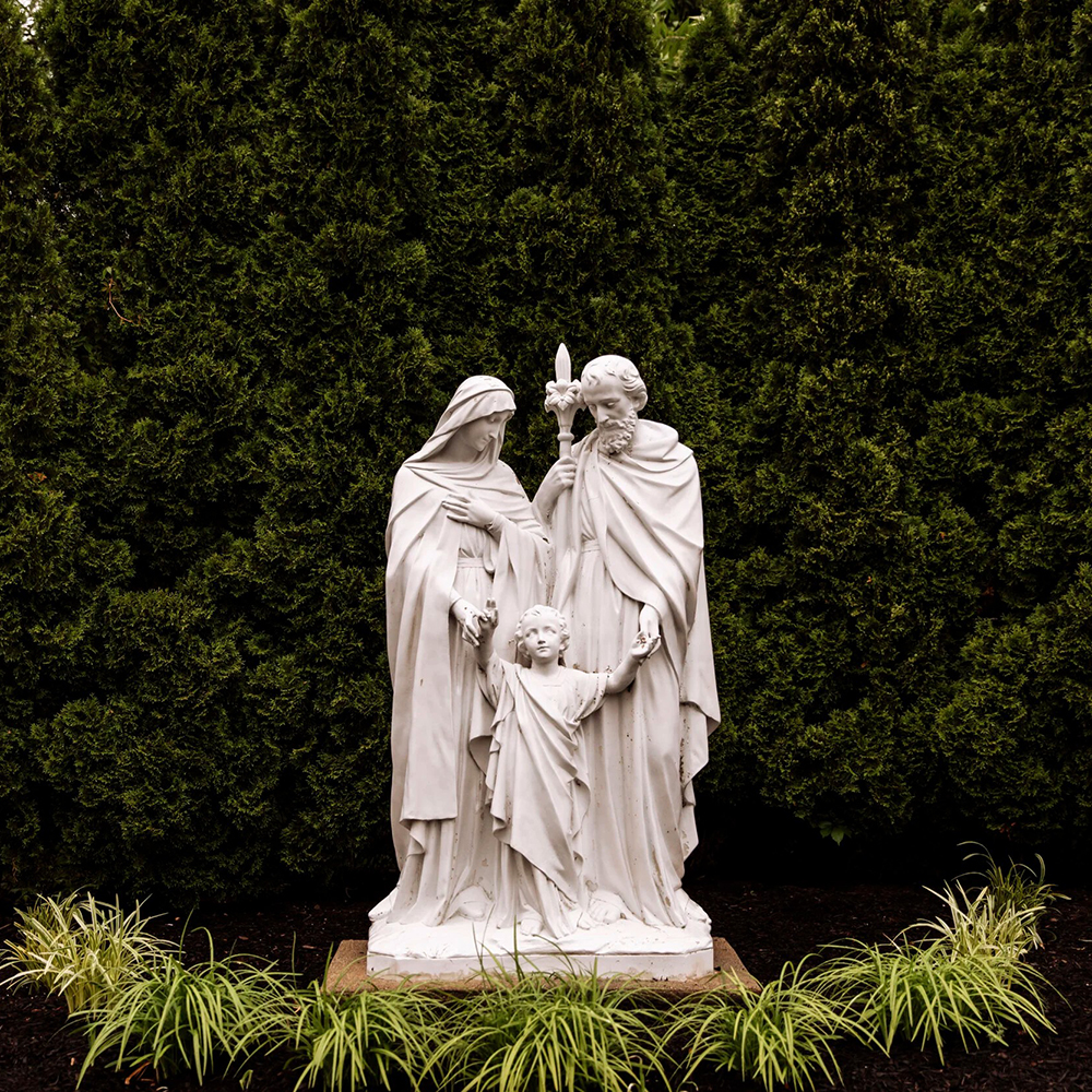Marble holy family statue outdoor in garden