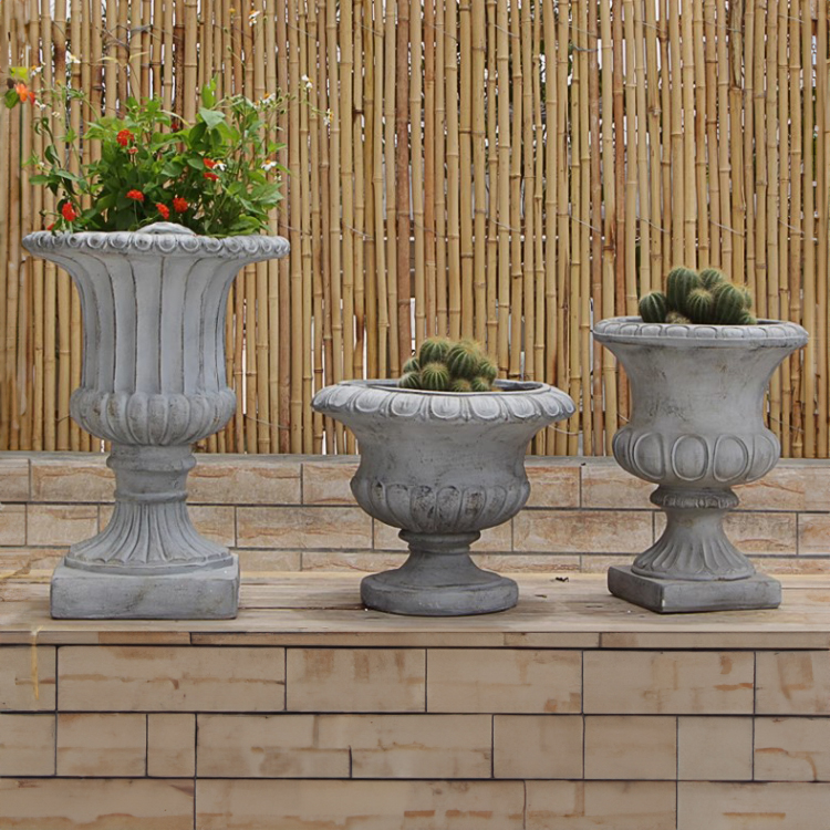Outdoor Stone Urn Planters in garden