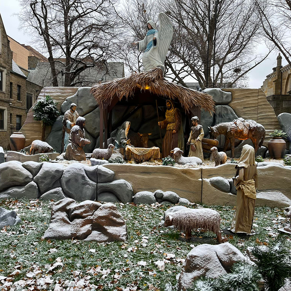 Snowy courtyard holy family statue outdoor display