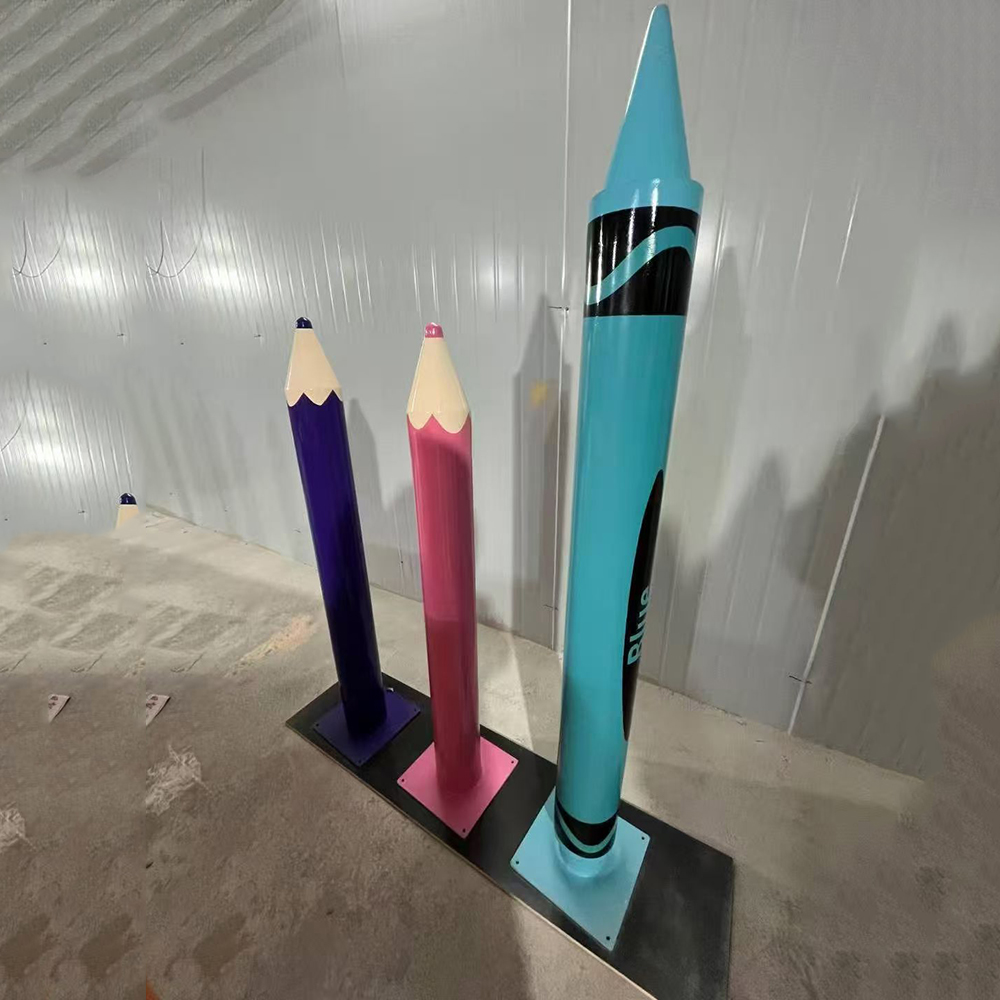 Blue fiberglass crayon art sculpture installation