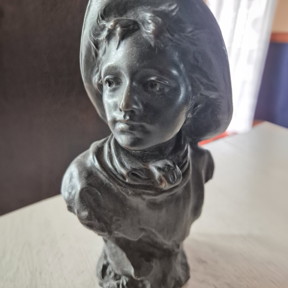 Bronze Bust of a Young Boy close face