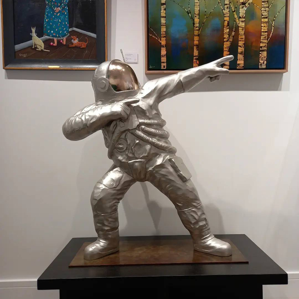 Bronze Spaceman Statue indoor dab pose