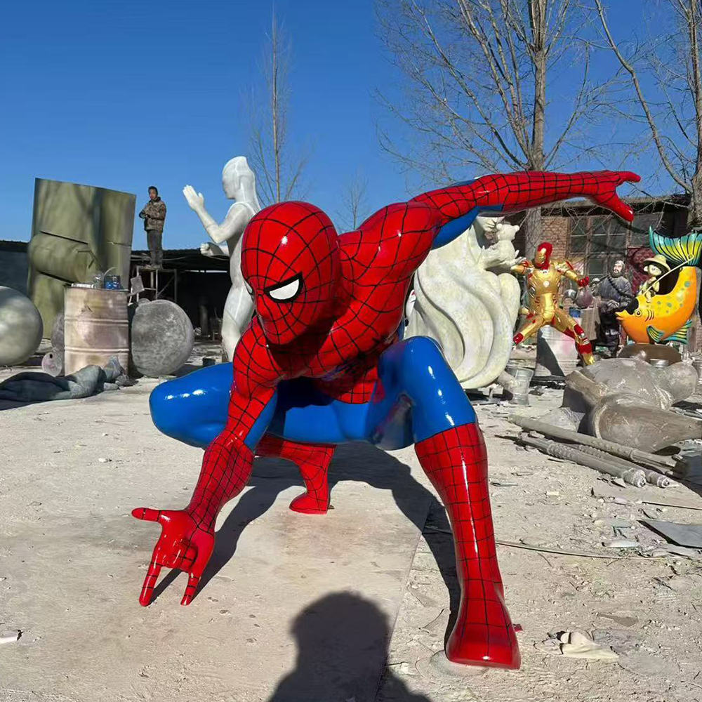 Fiberglass Statue of Spider Man crouching outdoors
