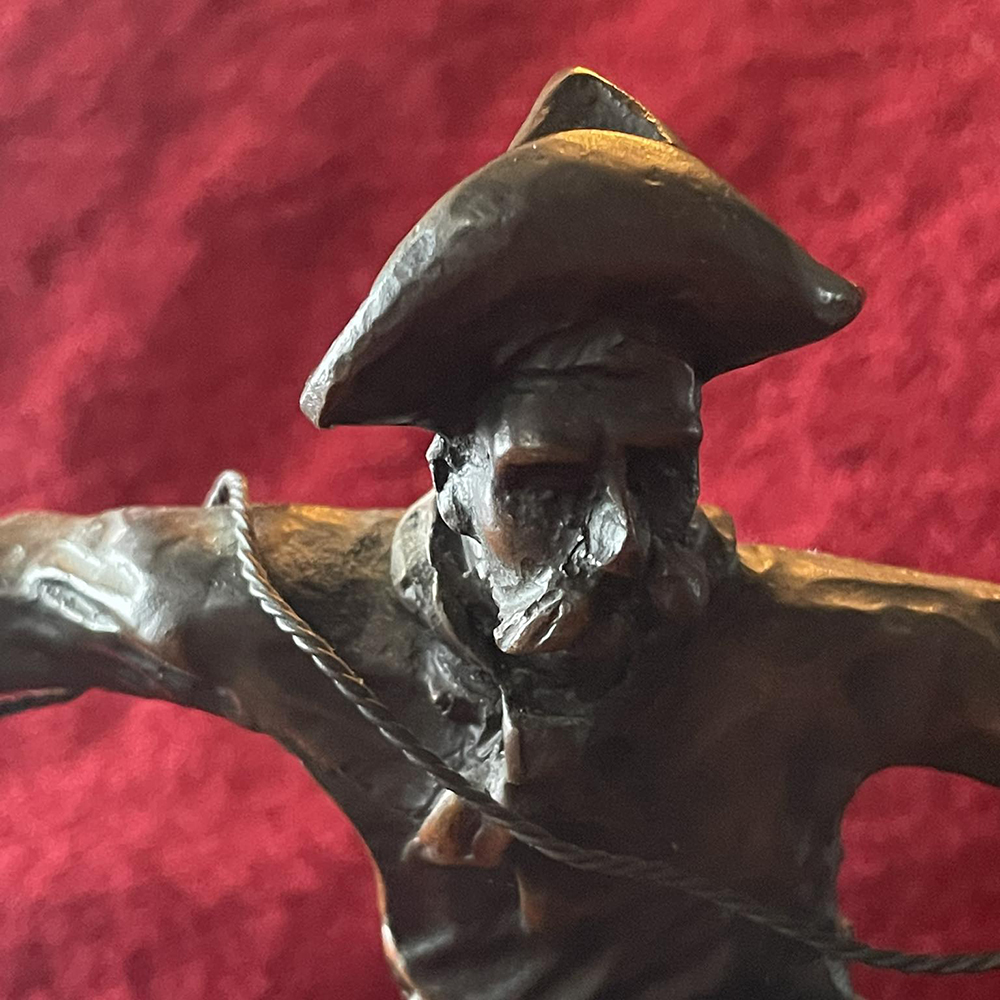 The Bronco Buster Statue bronze cowboy closeup
