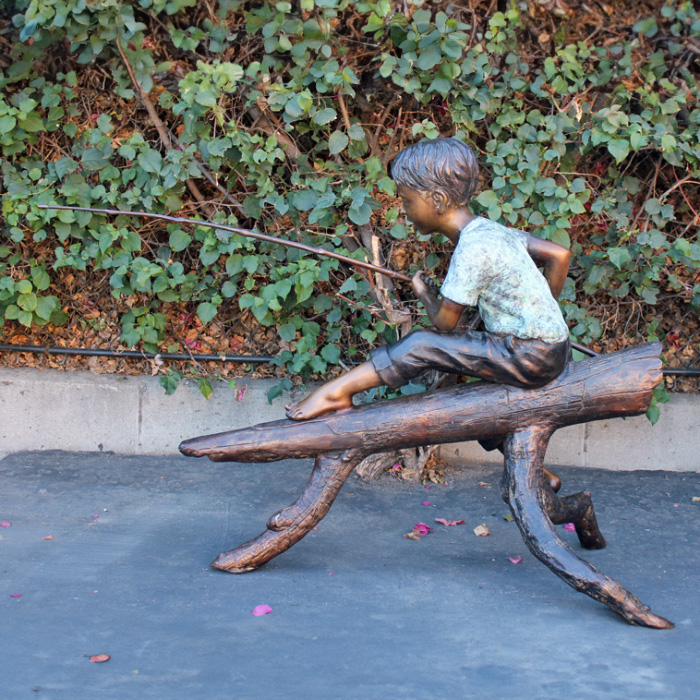 bronze Boy Fishing on Log Statue pondside