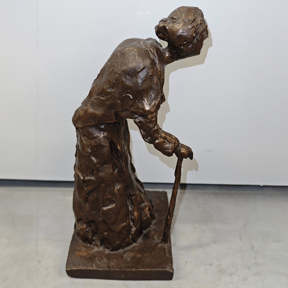 bronze Old Lady Sculpture walking with stick