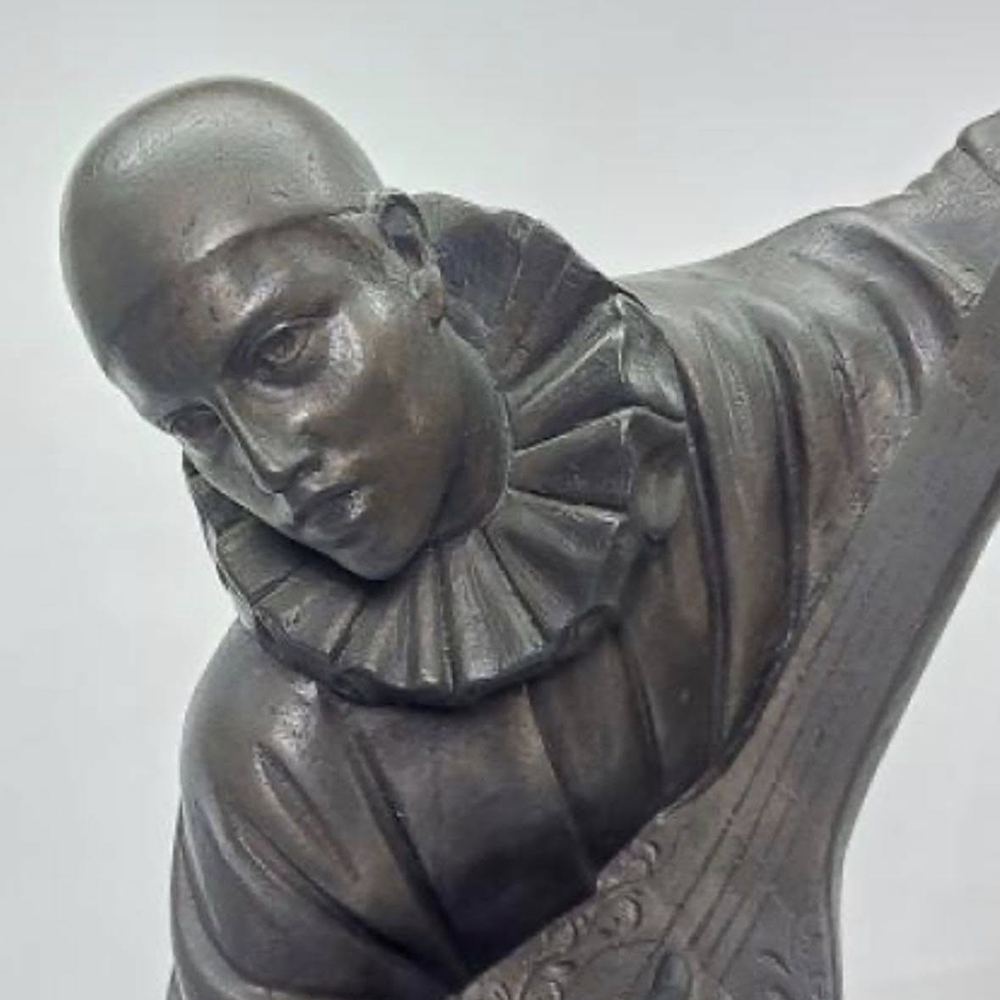 close-up Pierrot Sculpture musician face detail