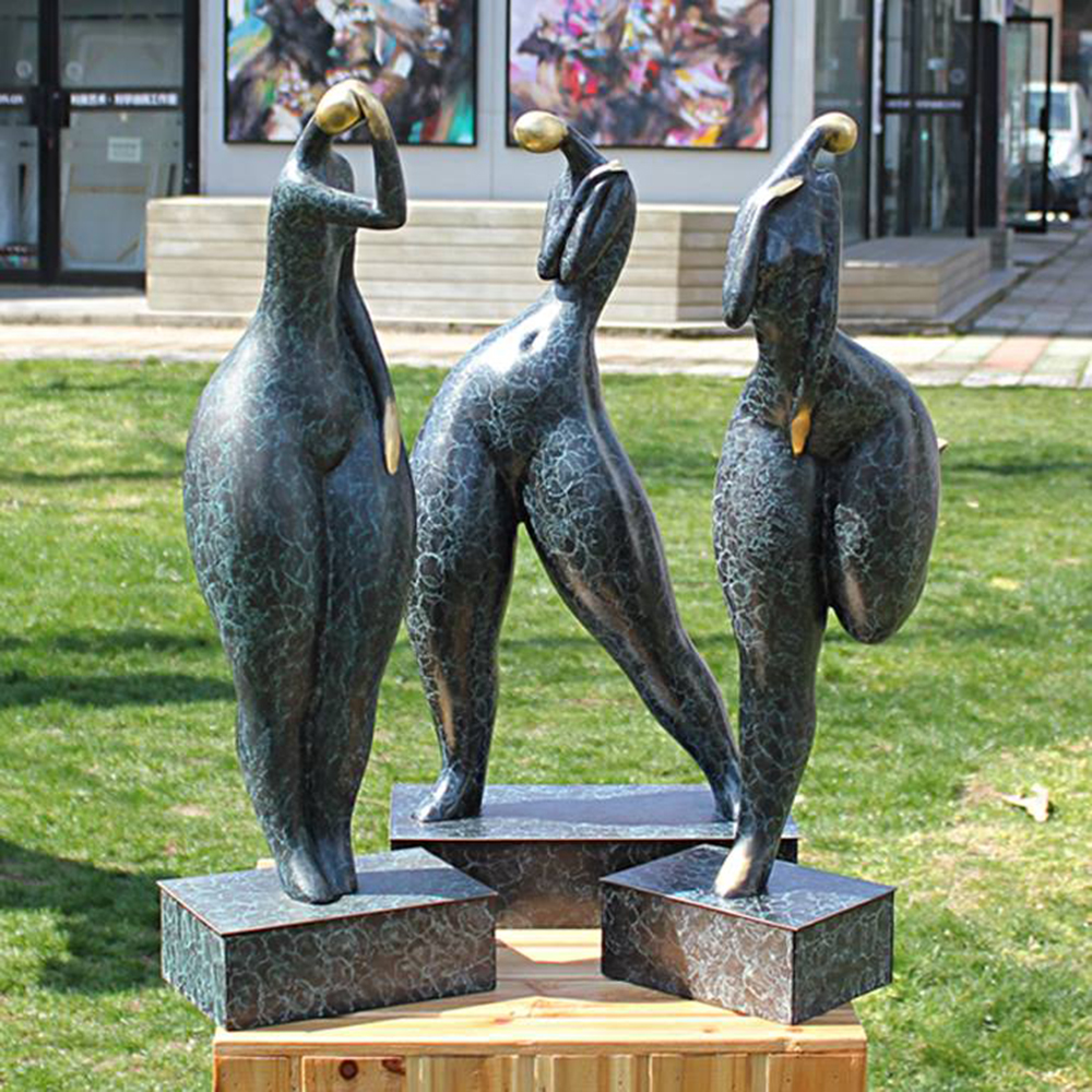 modern woman sculpture dancers outdoor display
