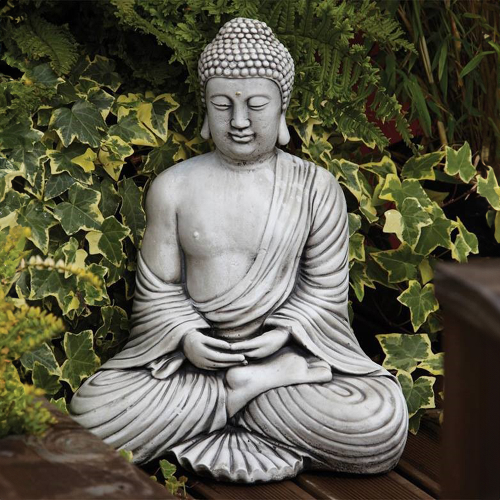stone Sitting Buddha Garden Statue among ivy