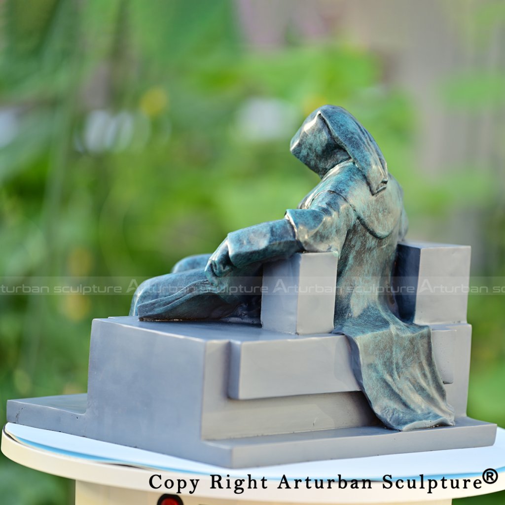 6 Bronze hooded figure sculpture side profile